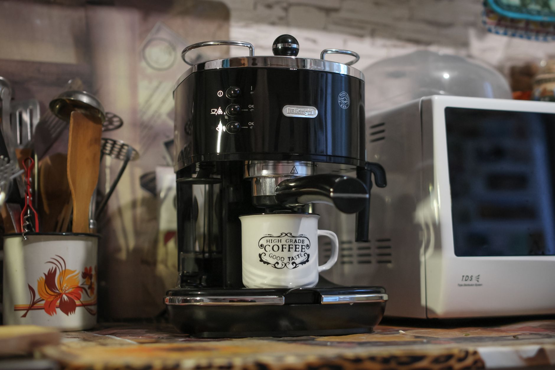 slim espresso machine on kitchen counter stainless steel