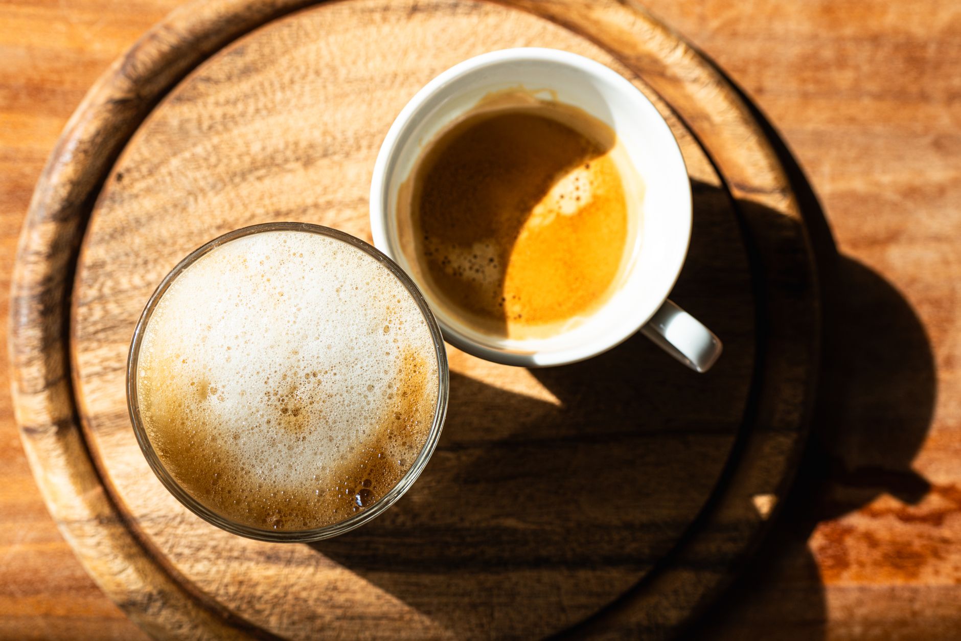 espresso shot pulling through portafilter golden crema close-up
