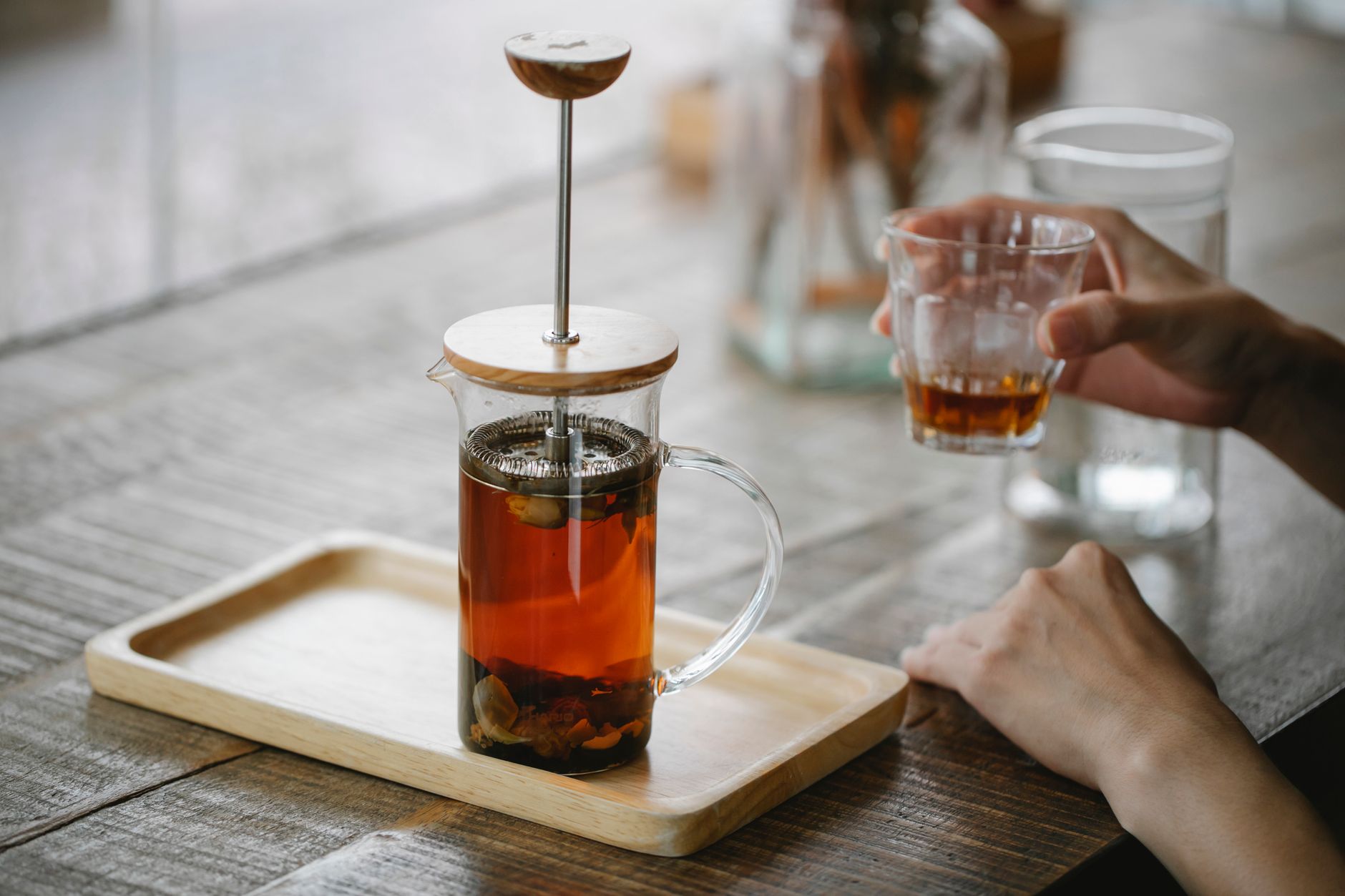 french press plunger pressing coarse ground coffee slow